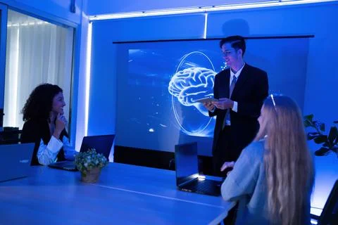 Business presentation on artificial intelligence in a modern office setting.. Stock Photos