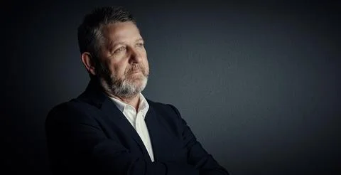 Business, problem solving and man in studio, arms crossed and attorney on d.. Stock Photos
