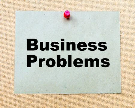 Business Problems  written on paper note pinned with red thumbtack  Stock Photos