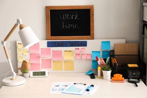 Business process planning and optimization. Workplace with lamp, colorful p.. Stock Photos