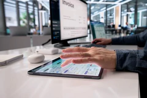 Business Professional Analyzes Expense Data On Tablet For Corporate Finance M Stock Photos