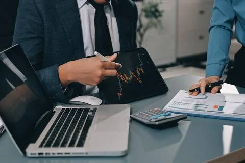 Business professional analyzing financial data on digital tablet dashboard .. Stock Photos