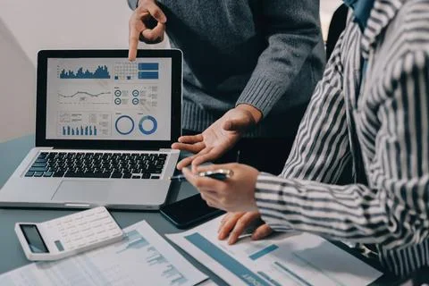 Business professional analyzing financial data on digital tablet dashboard .. Stock Photos