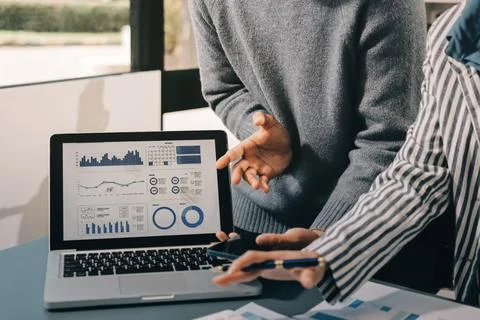 Business professional analyzing financial data on digital tablet dashboard .. Stock Photos