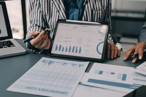 Business professional analyzing financial data on digital tablet dashboard .. Stock Photos