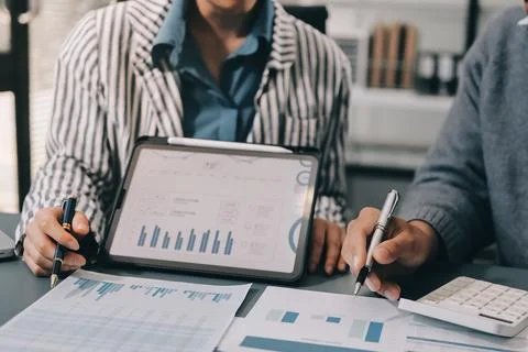 Business professional analyzing financial data on digital tablet dashboard .. Stock Photos
