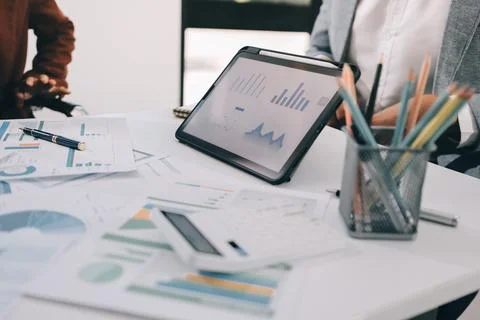 Business professional analyzing financial data on digital tablet dashboard .. Stock Photos