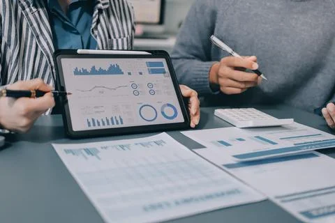 Business professional analyzing financial data on digital tablet dashboard .. Stock Photos