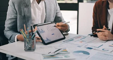 Business professional analyzing financial data on digital tablet dashboard .. Stock Photos