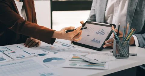 Business professional analyzing financial data on digital tablet dashboard .. Stock Photos