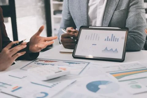Business professional analyzing financial data on digital tablet dashboard .. Stock Photos