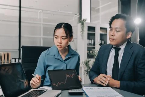 Business professional analyzing financial data on digital tablet dashboard .. Stock Photos