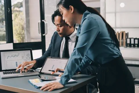 Business professional analyzing financial data on digital tablet dashboard .. Stock Photos
