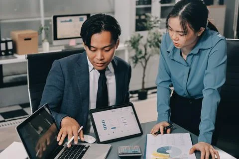 Business professional analyzing financial data on digital tablet dashboard .. Stock Photos