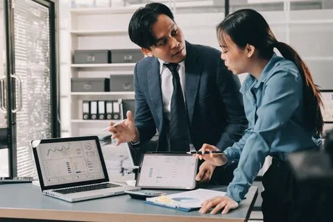 Business professional analyzing financial data on digital tablet dashboard .. Stock Photos