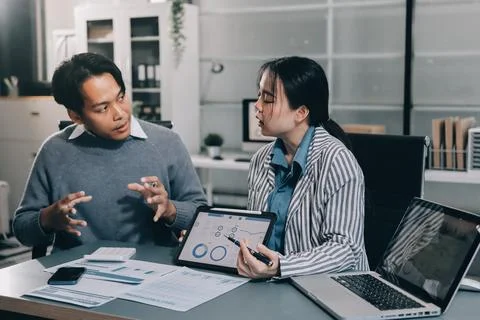 Business professional analyzing financial data on digital tablet dashboard .. Stock Photos