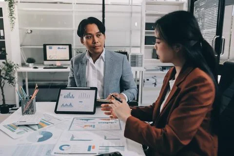 Business professional analyzing financial data on digital tablet dashboard .. Stock Photos