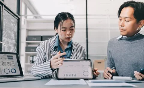Business professional analyzing financial data on digital tablet dashboard .. Stock Photos