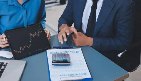 Business professional analyzing financial data on digital tablet dashboard .. Stock Photos