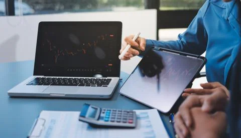Business professional analyzing financial data on digital tablet dashboard .. Stock Photos