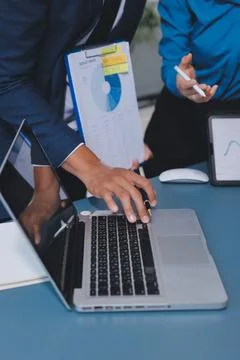 Business professional analyzing financial data on digital tablet dashboard .. Stock Photos