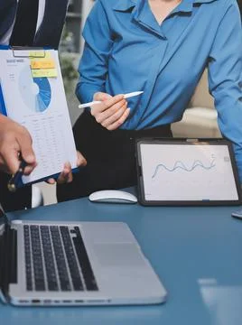 Business professional analyzing financial data on digital tablet dashboard .. Stock Photos