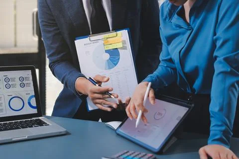 Business professional analyzing financial data on digital tablet dashboard .. Stock Photos