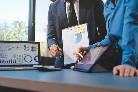 Business professional analyzing financial data on digital tablet dashboard .. Stock Photos