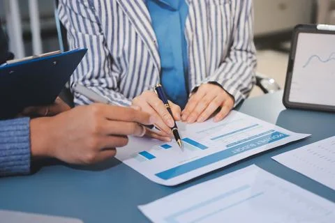 Business professional analyzing financial data on digital tablet dashboard .. Stock Photos