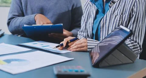 Business professional analyzing financial data on digital tablet dashboard .. Stock Photos