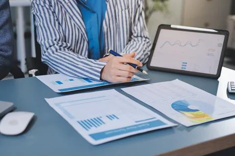 Business professional analyzing financial data on digital tablet dashboard .. Stock Photos