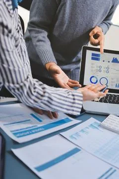 Business professional analyzing financial data on digital tablet dashboard .. Stock Photos