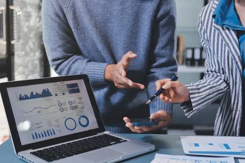 Business professional analyzing financial data on digital tablet dashboard .. Stock Photos