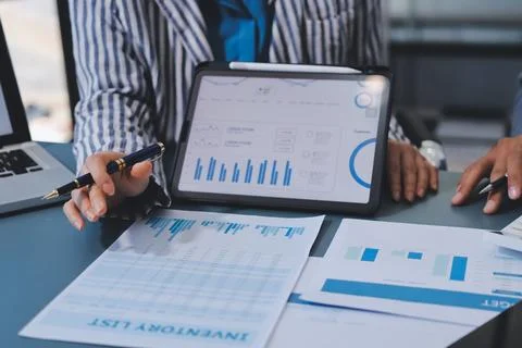 Business professional analyzing financial data on digital tablet dashboard .. Stock Photos