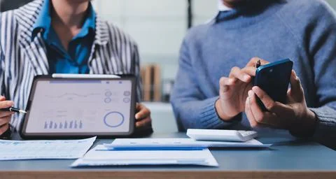 Business professional analyzing financial data on digital tablet dashboard .. Stock Photos