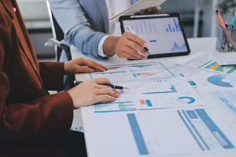 Business professional analyzing financial data on digital tablet dashboard .. Stock Photos
