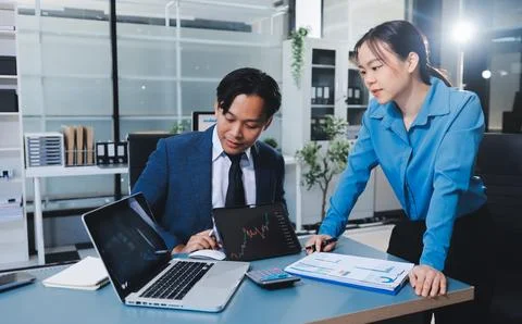 Business professional analyzing financial data on digital tablet dashboard .. Stock Photos