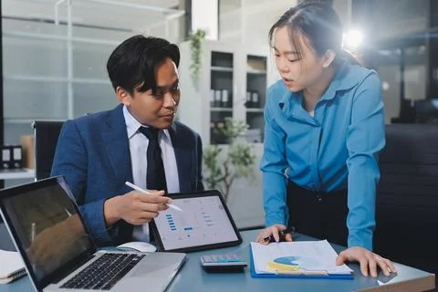 Business professional analyzing financial data on digital tablet dashboard .. Stock Photos