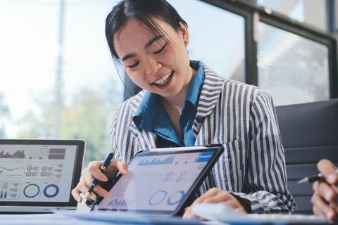 Business professional analyzing financial data on digital tablet dashboard .. Stock Photos