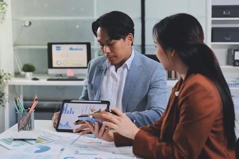 Business professional analyzing financial data on digital tablet dashboard .. Stock Photos