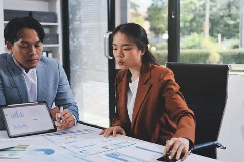 Business professional analyzing financial data on digital tablet dashboard .. Stock Photos