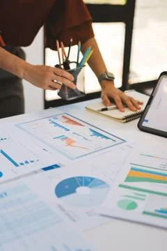 Business professional analyzing financial data on digital tablet dashboard .. Stock Photos