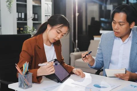 Business professional analyzing financial data on digital tablet dashboard .. Stock Photos