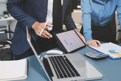 Business professional analyzing financial data on digital tablet dashboard .. Stock Photos