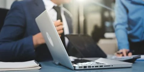Business professional analyzing financial data on digital tablet dashboard .. Stock Photos