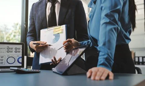 Business professional analyzing financial data on digital tablet dashboard .. Stock Photos