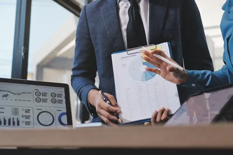 Business professional analyzing financial data on digital tablet dashboard .. Stock Photos