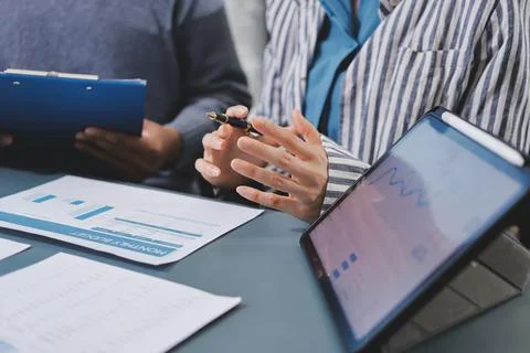 Business professional analyzing financial data on digital tablet dashboard .. Stock Photos