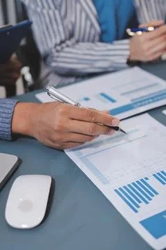 Business professional analyzing financial data on digital tablet dashboard .. Stock Photos