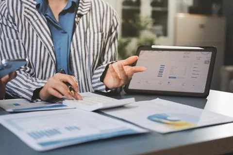 Business professional analyzing financial data on digital tablet dashboard .. Stock Photos